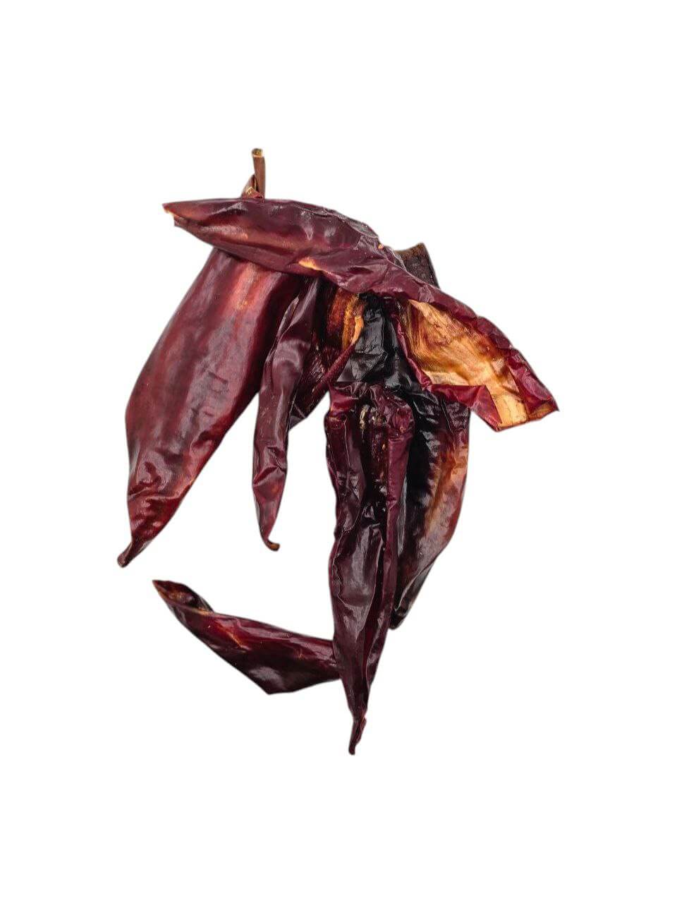 Hela Röda Söta Paprikor - Soltorkade - a close-up of sun-dried sweet red peppers showcasing their rich color and texture.